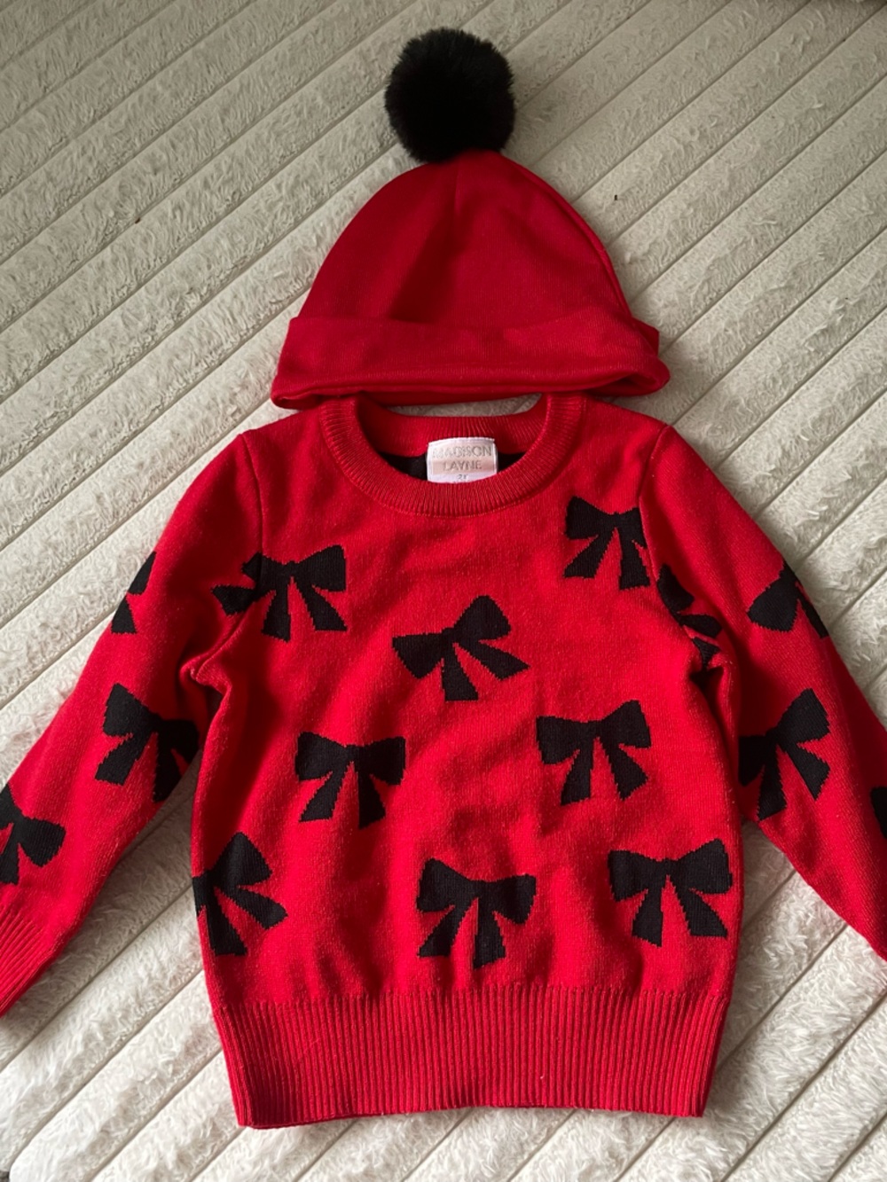 Madison Red Sweater with Black Bow Motif and Pom Pom Beanie